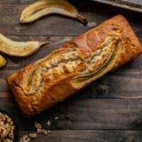 Gluten Free Banana Bread slice on wooden board